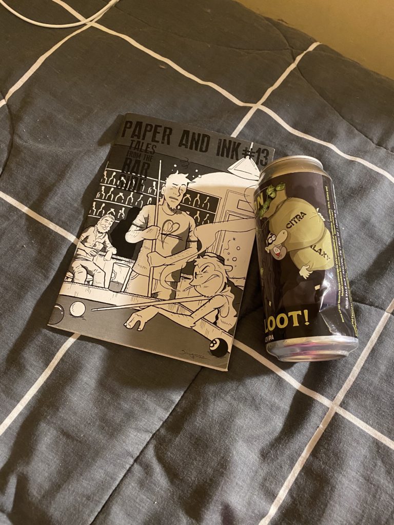an empty beer can with an illustration of Lenny from The Simpsons, and to its left, the front cover of a zine with an illustration of people playing pool in a pub